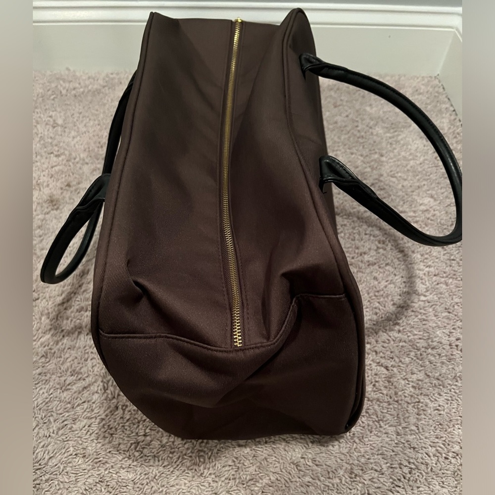 Million perfume brand duffle bag in brown